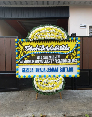 Papan Bunga Duka di Rurukan Satu